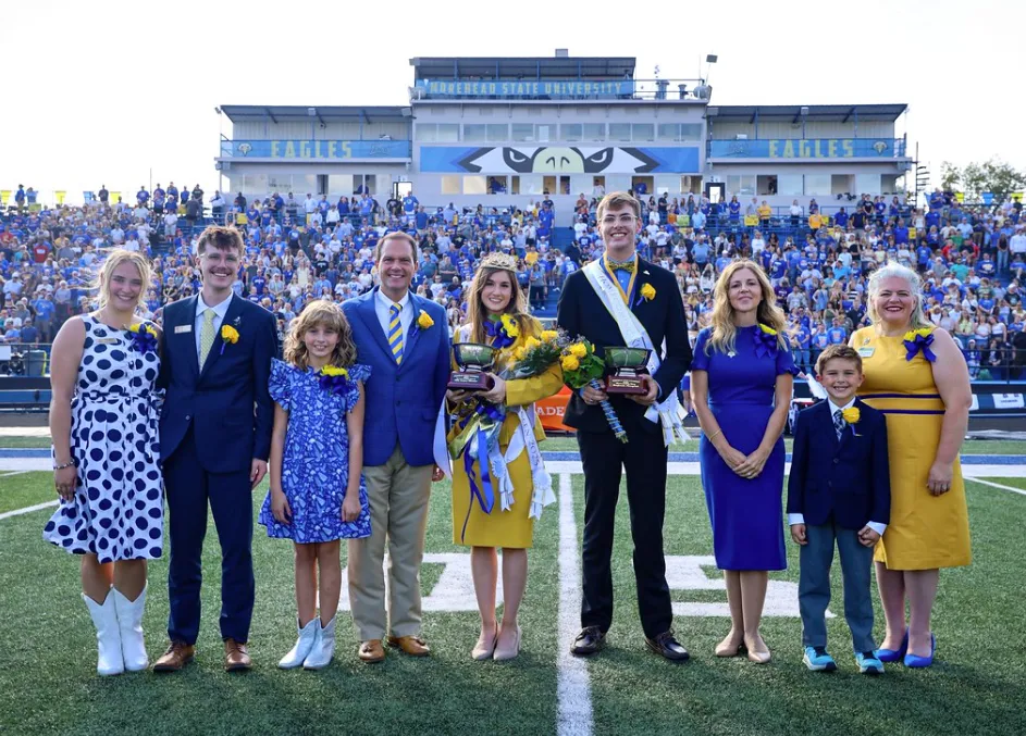 The 2025 homecoming king and queen and their families.