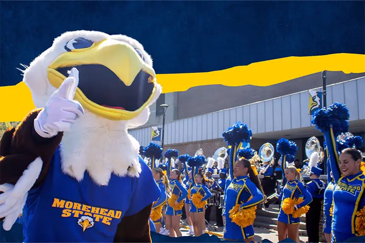 MSU eagle mascot beaker cheering at a football game