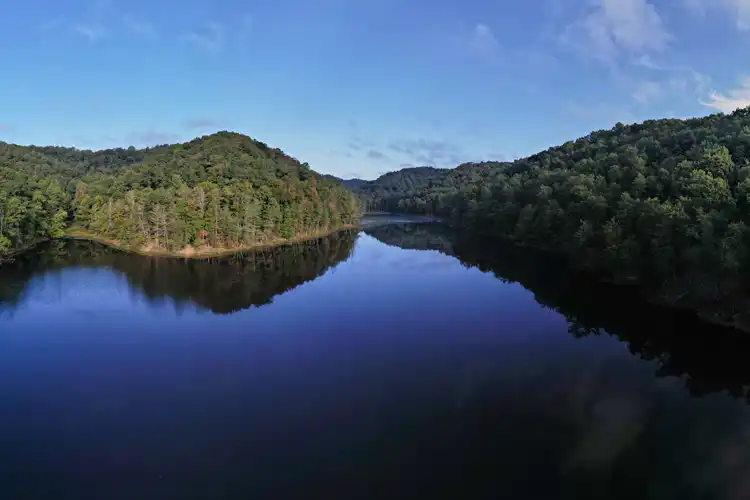 Eagle Lake with blue sky and trees in late summer