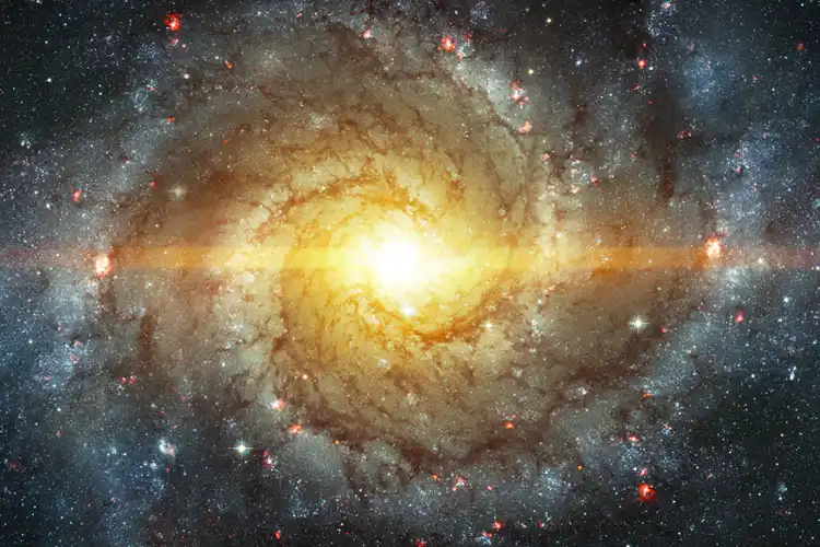 image of a swirling universe with a bright star at the center