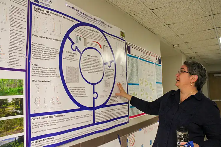 Jen O'Keefe showing student posters.