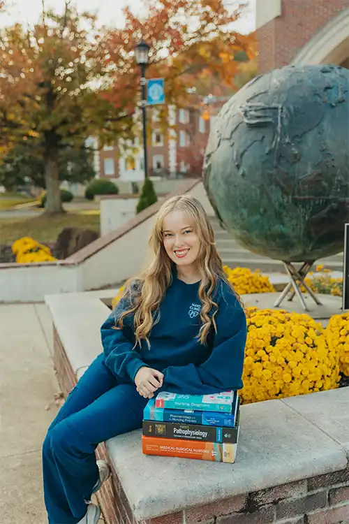 Picture of Meredith Hennion in Mayo Clinic sweater on Morehead State campus.