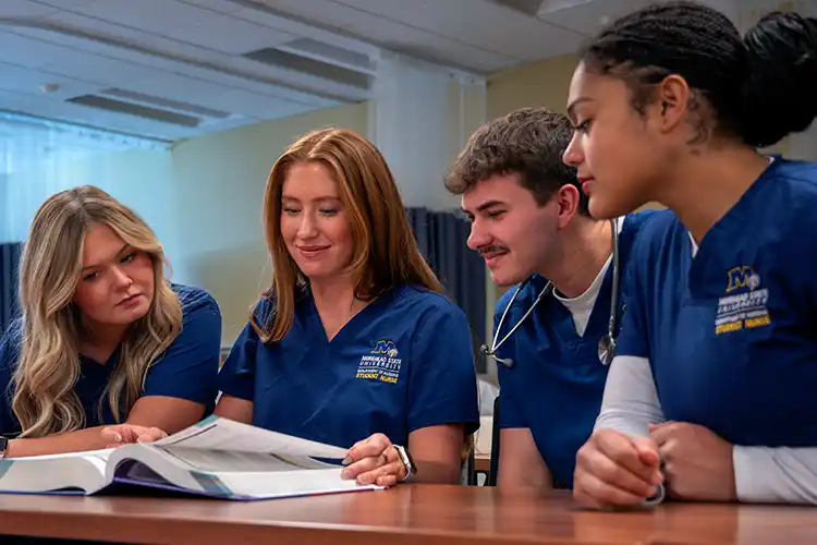Morehead State Nursing Students Reading a Textbook.