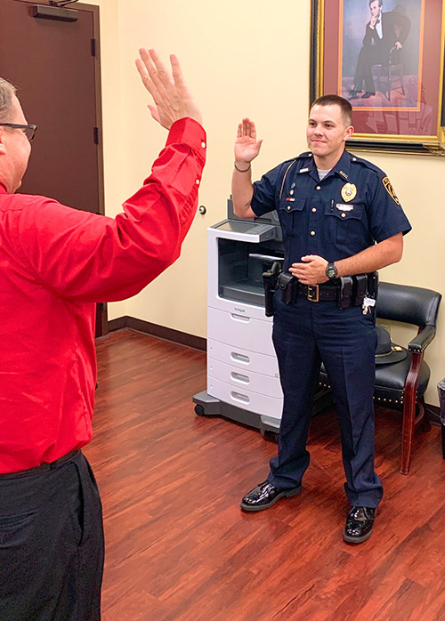 Officer Zach Cliine and District Judge William Roberts
