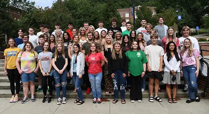 pic of students at the Little Bell Tower in 3 rows